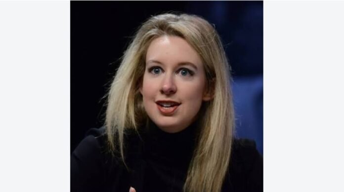 Nathan Fielder and Elizabeth Holmes face each other in a scene from the A24 documentary 'You Can See Everything' trailer